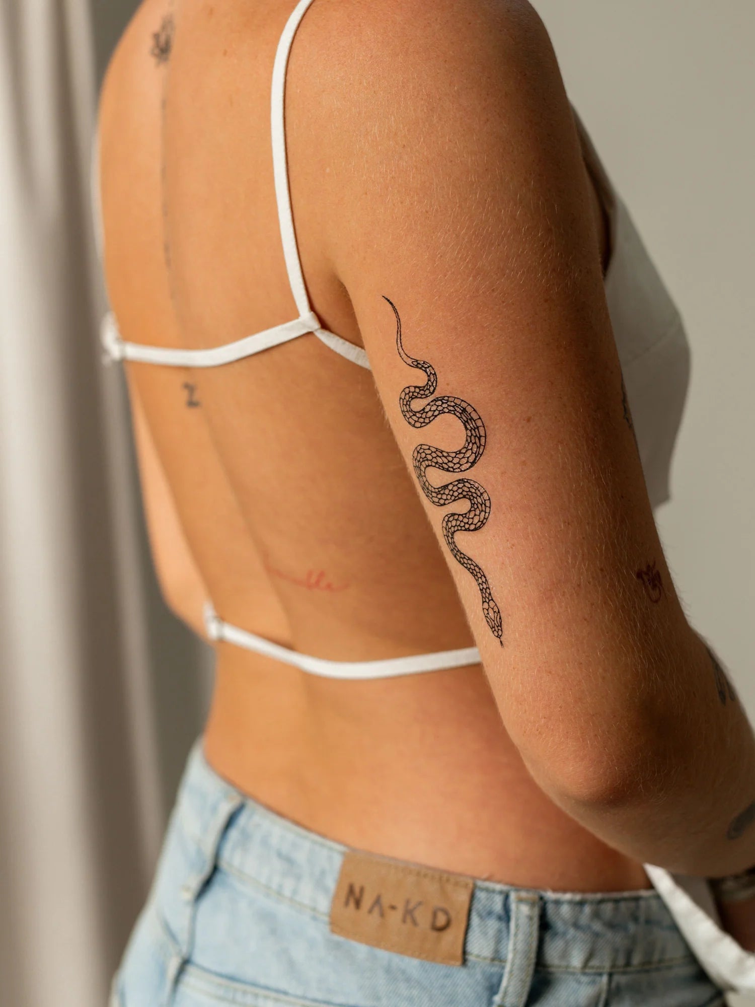 Vedligehold en midlertidig tatovering på lang sigt: 7 nyttige tips